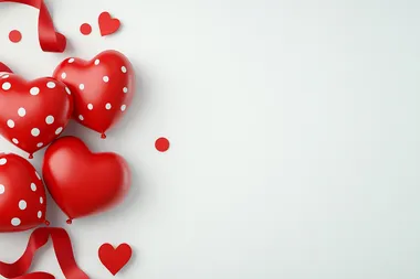 3D red hearts and polka-dot ribbons on a bright white background with confetti accents, flat lay.   bfjamcp --s 250