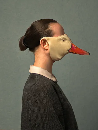 A melancholy photograph of the profile view of a girl wearing a vintage goose mask, in the style of Michael Borremans     rofile cq68b4z --oref