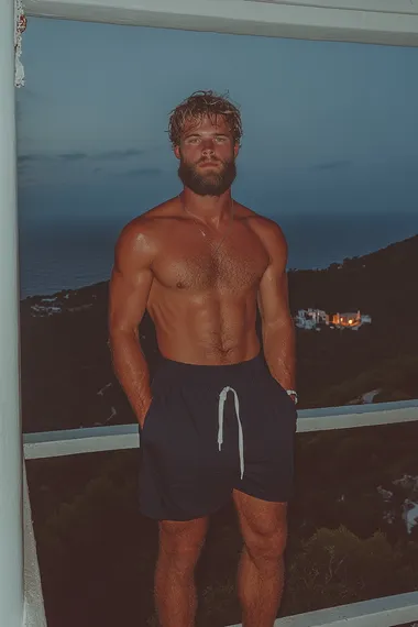 brutal handsome European man with beard in very long oversize untucked dark blue T-shirt standing at a large window with a view of Impressive mountains, very long oversize untucked dark blue T-shirt, front lighting, neon lighting, brutal face, gray eyes color, contrast colors, pinterest style, instagram style   --s 750   fbkwo1t