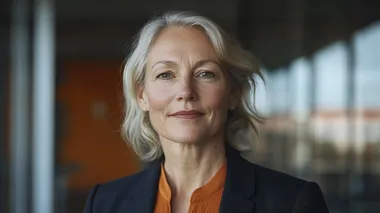 A professional portrait of a confident middle-aged businesswoman, elegantly dressed in a tailored blazer and silk blouse, featuring a custom color palette of warm coral-orange (#F98A71), deep purple (#9265C4), soft cream (#F2ECCE), and vibrant turquoise-green (#6BF2C1). Her poised and determined expression conveys leadership and wisdom. Her short, well-styled hair frames her face, and subtle makeup enhances her natural features. The softly blurred background showcases a modern office with large windows, reflecting hues of the custom color scheme. Cinematic and high-end corporate feel, shot with a Canon EOS R5, 85mm f/1.2 lens, shallow depth of field, natural and balanced lighting, photorealistic textures   rofile d7sot8n