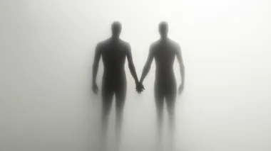 two figures holding hands behind a frosted glass, on a white background