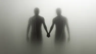 two figures holding hands behind a frosted glass, on a white background