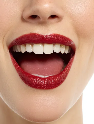 A hyper-realistic photo of wide mounth red lips with the tongue showing to the left, on a white background.
