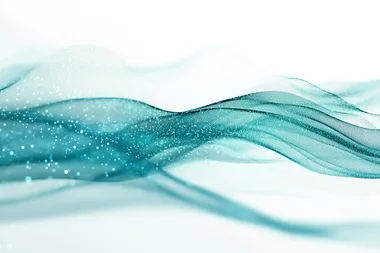 Teal and blue light particles move across a white background, leaving lines and trails in a uniform direction, flowing like a river of light, slightly out of focus.
