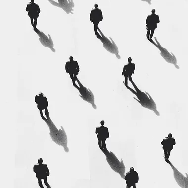 "Top-down view of people, minimalist black silhouettes, white background