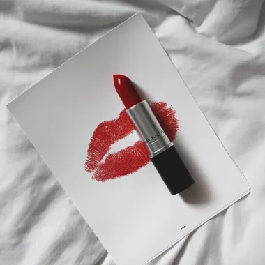 a red lipstick print on a white background