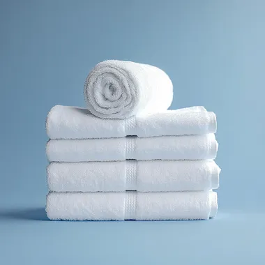 a stack of towels with a towel roll on top. I want isometric angle shot, i want hyper-realistic Canon EOS photography