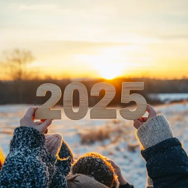 Happy New Year concept, a group of people holding wooden numbers "2025" in their hands against a sunset background, a winter landscape, New Year celebration and lifestyle, realistic
