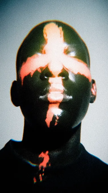 A futuristic, high-contrast portrait of a person with jet-black, ultra-glossy skin, set against a bold, vibrant blue background. The face is dramatically stylized with a glowing neon-orange cross painted or projected over the forehead, nose, and mouth, creating a striking, symmetrical design. The lips are reflective, metallic black with partial orange accents. The eyes glow intensely red, adding a surreal and intimidating effect. Lighting is studio-clean and hyper-saturated, emphasizing surface reflections and texture. The overall style is cyber-gothic, avant-garde, and extremely sharp, with no grain, no blur, and extreme color contrast   rofile 8b747ss yidgi4z