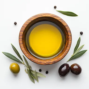 birdseye view of olive oil in a wooden bowl and a few olives placed outisde the bowl, set it up in a photographic and minimal way, add white background --s 250