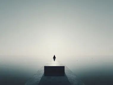 surreal minimal landscape with floating person in seated meditation position and faint horizon, neutral background, soft shadows, dreamlike stillness, introspective symbolism, designed for meditative poster  rofile nprqg4q