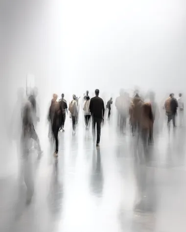 Blurred human figures in motion, against a white background with minimalist text, creating an abstract and artistic composition. The blurred images of the people create depth and movement within the scene while also serving as visual elements for design or graphic work. The overall effect is one that captures both contemporary aesthetics and emotional essence through its simplicity and minimalistic approach.