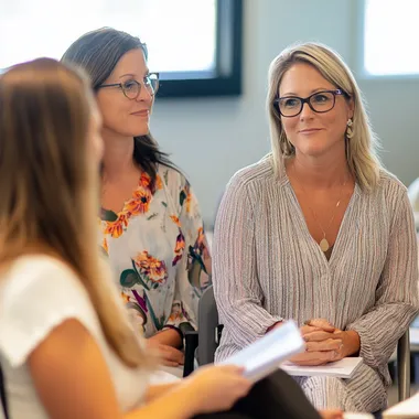 ladies working in legal and compliance sitting in a leadership coaching cohort