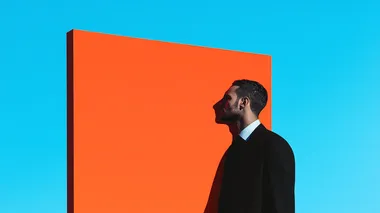 representing the multiplicity of self-perception. The color palette consists of bold tones of orange and blue with sudden bursts of vibrant hues, illustrating the spectrum of human insights. Lighting is utilized to cast dynamic shadows, adding depth and emphasizing the contrast between the conscious and subconscious mind. Hasselblad H6D-100c 11mm f/22   rofile rf1fghp