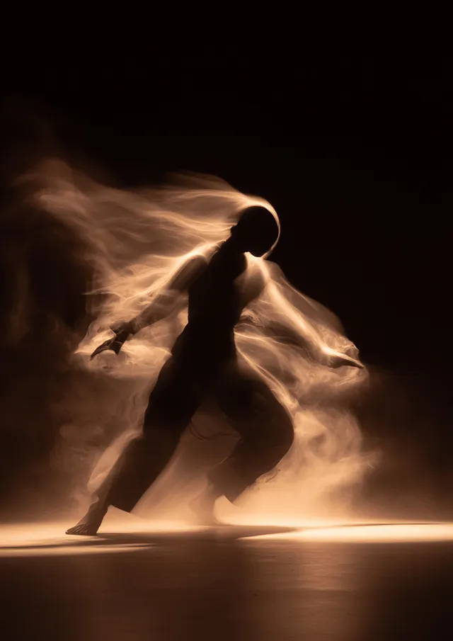 Dancer in Urban Nightscape with Strobe Lights Capturing Motion