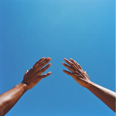 a Peaceful photo taken with kodachrome and a 28mm lens two arms of a person with latin skin streched up to the blue sky and crossing against each other with a blue sky on the back