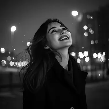 Realistic black and white photo happy girl with dark hair on the background of urban night landscape in black coat, atmosphere of joy and romance