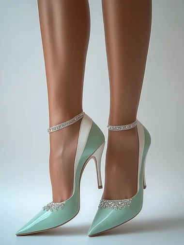 Mint and White Channel High Heels: Like a selfie posted on Instagram, everyday photo style, phone photo, realistic, detailed. Mint green high heels with a smooth leather design, paired with 12CM white stilettos and delicate rhinestone decorations. The design is fresh and trendy. The side close-up captures both feet in the heels with soft, natural lighting, with fair, slim legs looking brighter against the shoes, and the leg skin appearing smooth and refined