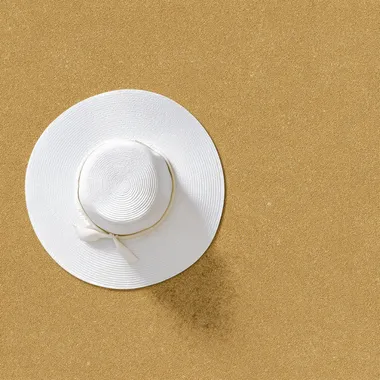 white hat, on sand background. Beach vacation concept .Top view with copy space, hyper realistic, 4K, --raw rofile 9o5bg9b