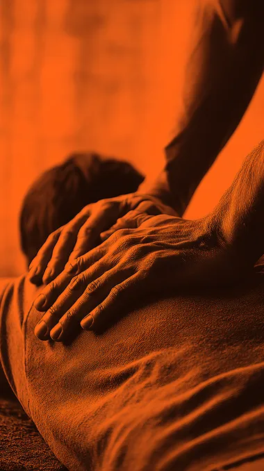 birdseye view photo realistic picture of man s hands massaging back of a woman on a massage table. Stock photo style. Orange muted tones