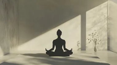 a woman and doing yoga in a minimal interior. her face is calm