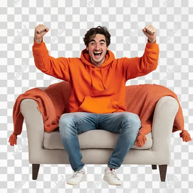 A white background studio with a stylish, modern sofa at its center. A young man in his mid-20s sits on the sofa, visibly excited, leaning slightly forward with a big smile on his face. Hes dressed casually in a bright hoodie and jeans, his hands raised mid-air as if celebrating a win or reacting to good news, with soft lighting, and a throw blanket adding warmth to the scene. The mood is energetic and uplifting, capturing a joyful moment.