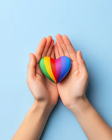 Hands Holding Rainbow Hearts, a professional studio shot of hands delicately presenting a vibrant rainbow heart, fingers elegantly positioned, minimalist soft-focus background,   ludog5a --s 250