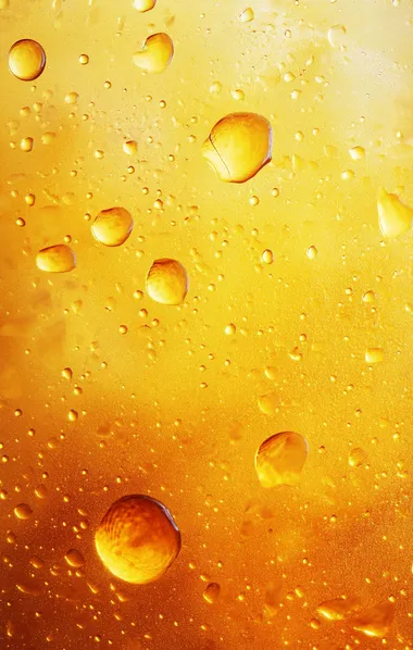 Amber-yellow abstract textured background, orange water droplets, modern art print for wall poster.