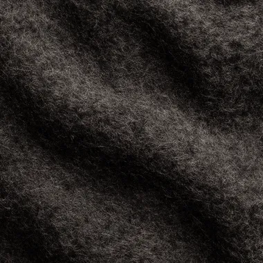 A seamless, ultra hd dark wool felt texture, flat top-view, with soft and diffuse shadows, subtle highlights from global illumination, showcasing the softness and natural grain of the fibers. Created Using: ultra-high-resolution texture capture, photorealistic wool simulation, advanced lighting techniques, soft focus on shadows, tonal gradients