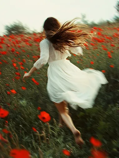 Retro movie style film photography,Slow shutter photography motion blur,A woman in a white dress ran through a field of red flowers,
