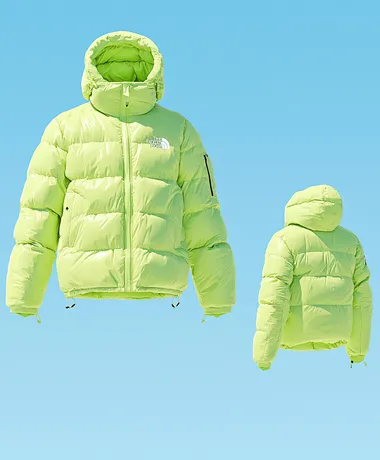 A bean green The North Face down jacket, flying in the sky above the snow-capped mountains. Product photography style, professional sports brand, blue sky background, clean background, a little dreamy color and halo, diagonal composition, high resolution, professional lighting and professional photography, high quality images, 32k    rofile m6levxq