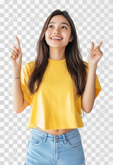 A cheerful Asia young woman with long brown hair, woversized yellow t-shirt, light blue ripped skinny jeans, is pointing upwards with both index fingers, smiling brightly. The background is a clean, white studio setting, emphasizing the woman's joyful expression. The focus is on her positive and energetic demeanor. The lighting is soft and even, highlighting her features while maintaining a natural and inviting look.