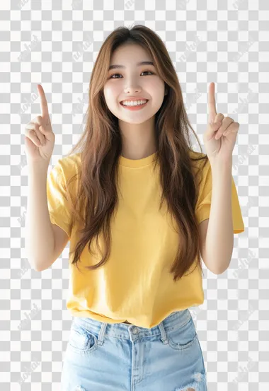 A cheerful Asia young woman with long brown hair, woversized yellow t-shirt, light blue ripped skinny jeans, is pointing upwards with both index fingers, smiling brightly. The background is a clean, white studio setting, emphasizing the woman's joyful expression. The focus is on her positive and energetic demeanor. The lighting is soft and even, highlighting her features while maintaining a natural and inviting look.