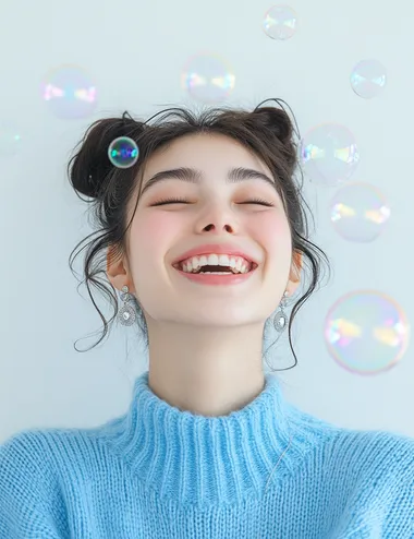 A photo of a happy woman with her hair in a bun, wearing silver earrings and a blue sweater against a white background with soap bubbles around her head, in the style of Clothesam Lau, with a laughing expression.