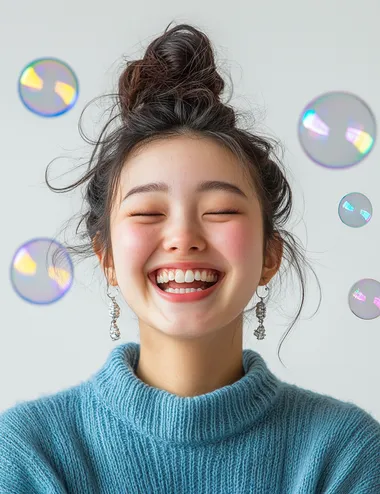 A photo of a happy woman with her hair in a bun, wearing silver earrings and a blue sweater against a white background with soap bubbles around her head, in the style of Clothesam Lau, with a laughing expression.