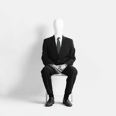 man in suit, sitting on a simple chair, front view, without head, photo, white background