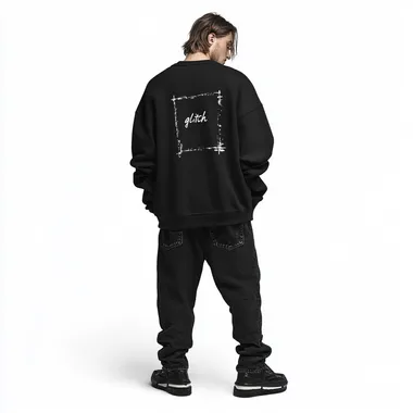 imagine print for textile sweatshirt using as a main theme "glitch" on a black washed sweatshirt, oversized fit and round neck collar, worn by a man in black baggy jeans, white background, streetwear style, high-resolution photography