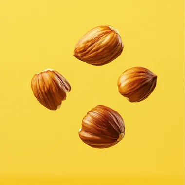 advertising poster of three hazelnuts flying on solid yellow background   --s 250