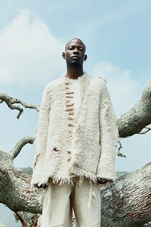 Eco-Chic Fashion Editorial with Black Male Model on Tree Trunk