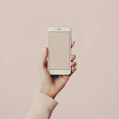 high fashion, female hand, holding a smartphone, minimalistic setting, cream white