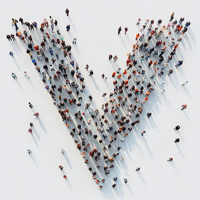 Large group of people forming a V shape in an outdoor park setting