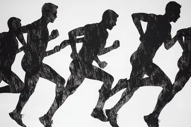 black shilouettes of running men and women finishing on white background