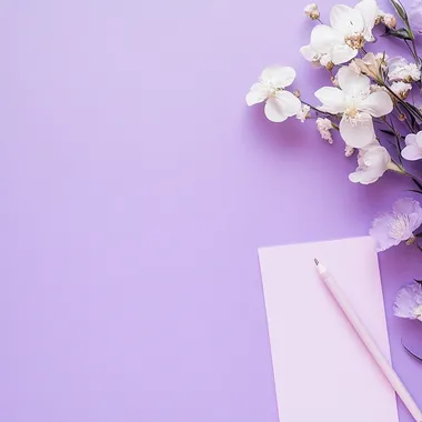 photography of a pastel purple background with flowers on a corner and stationery items on the other corner, realistic photography