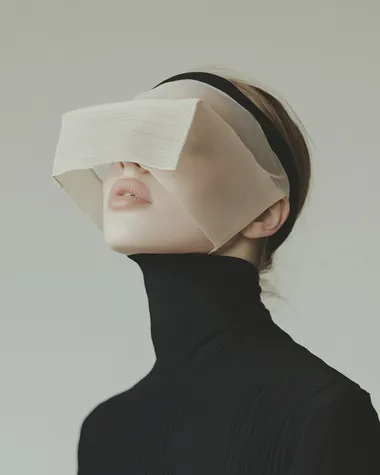 Thin and delicate amorphously organic glasses made of cloth material. Worn by a mobel   dl5ez83