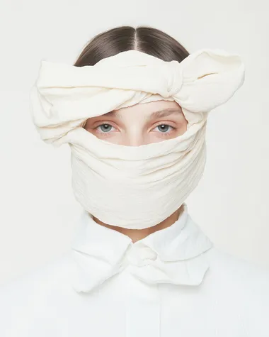 Thin and delicate amorphously organic glasses made of cloth material. Worn by a mobel   dl5ez83