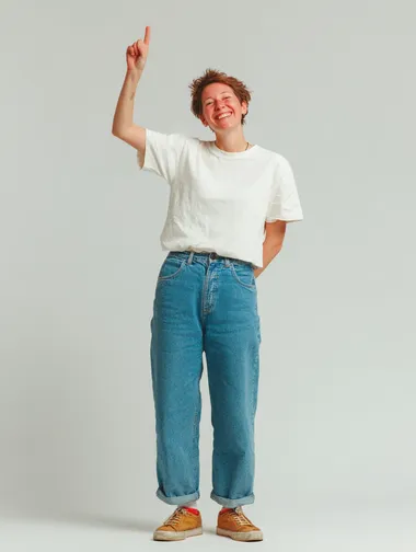 young happy woman with one hand up, wears jeans and a white t.shirt. isolated white background. full body shot  rofile b4lvlaf