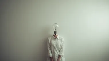 Single thoughtful person with lightbulb icon above head, simple white background, creative concept, soft ambient glow, f/3.5    --raw