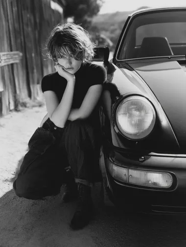 by herb ritts, same girl, leaning against porsche 911  --raw