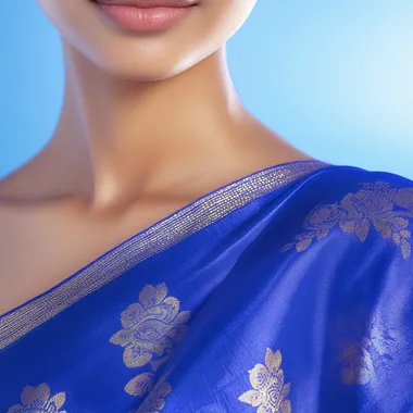 A close-up of a woman's shoulder and arm with glowing, radiant skin, wearing a simple yet elegant Sinhala New Year outfit in deep blue. The image highlights skin protection with a soft, golden sunbeam effect. The background is a bright, clean gradient of blue and white, evoking a fresh and protective feel. High-quality, photorealistic, commercial advertisement style