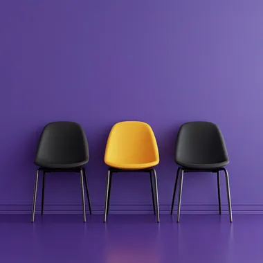 A hyper-realistic, high-resolution photograph of five chairs neatly aligned side by side in a modern interior setting. Four of the chairs are dark-colored (black or deep plum), and the center chair is bright yellow, placed precisely in the middle to draw focus. The scene is set against a smooth matte purple wall and a matching purple floor, creating a soft monochromatic atmosphere. The lighting is natural softbox-style, coming slightly from the side and above, subtly highlighting the texture and color of the yellow chair to make it stand out. Include soft shadows, reflections on the floor, and slight depth of field (bokeh effect) to mimic a shot taken with a DSLR camera using a 50mm f/1.8 lens. The overall image should feel sharp, clean, and cinematic, with balanced contrast and realistic material textures like fabric and plastic or metal on the chairs.